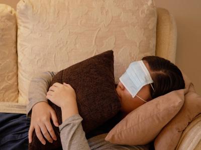 Humor, asian young adult using face mask cover her eyes sleeping