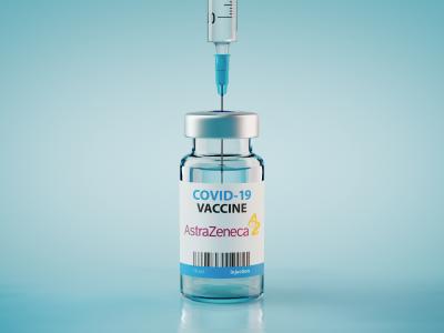 Sofia, Bulgaria - December 14, 2020: AstraZeneca COVID-19 Coronavirus Vaccine and Syringe. Conceptual image.